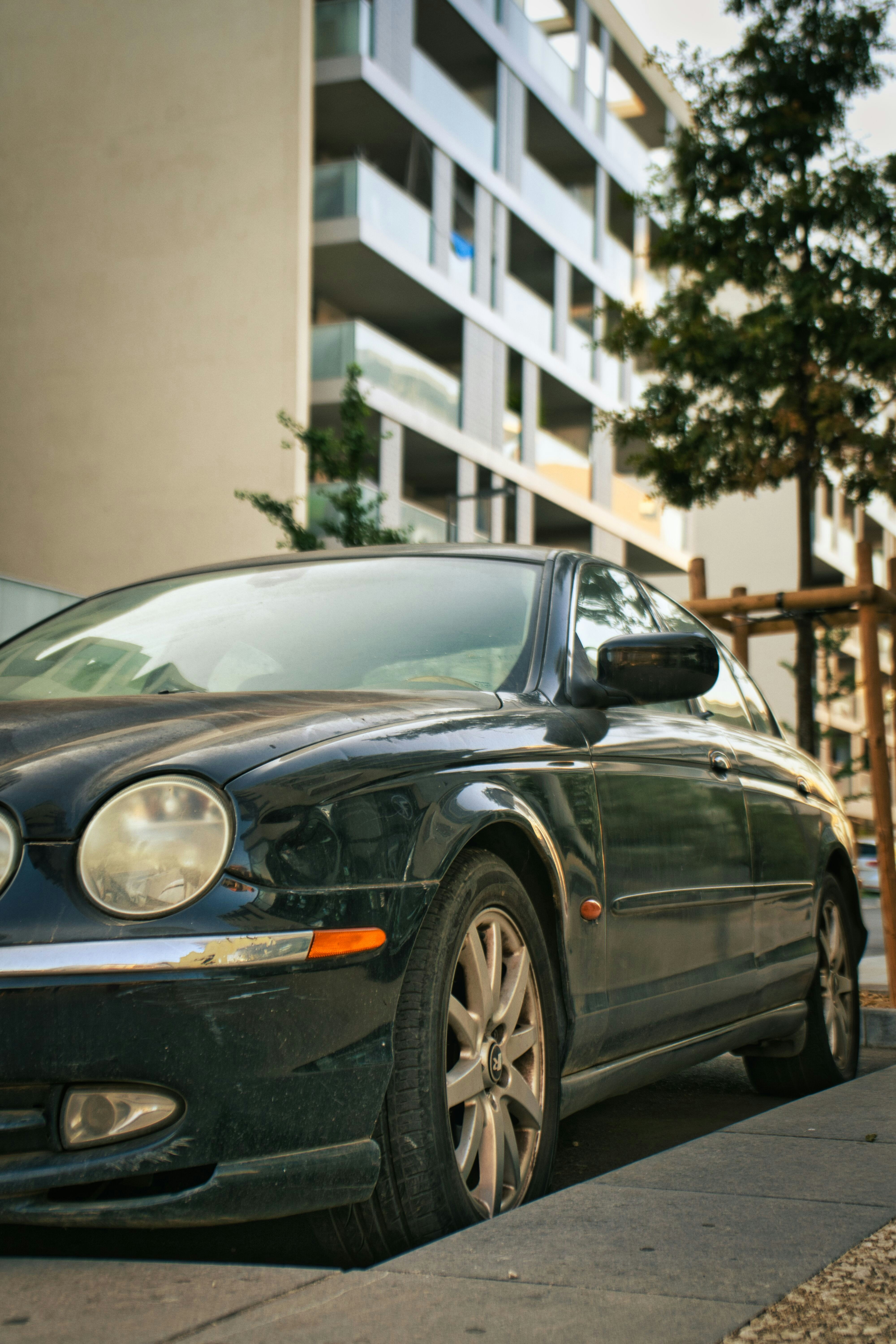 A black car parked on the side of a street photo – Free Montpellier ...