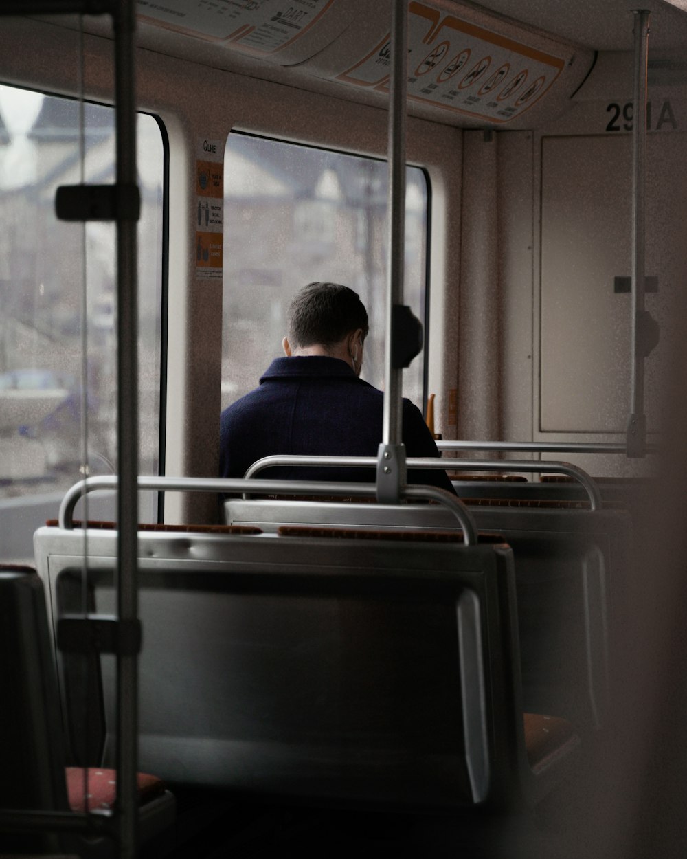 a person sitting in a bus