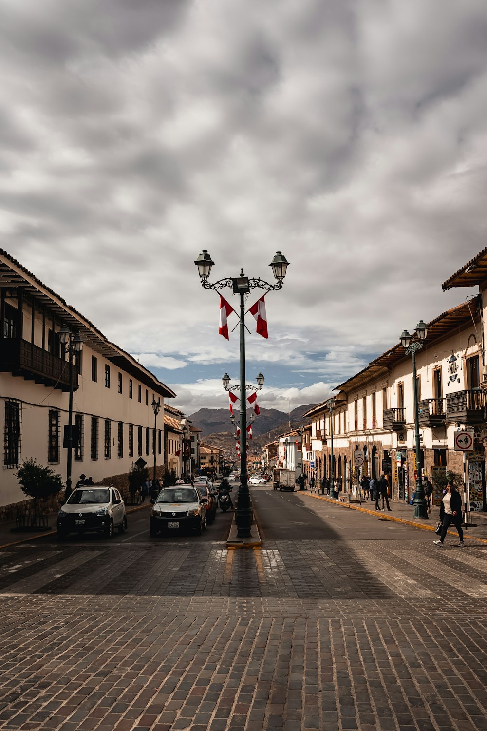 a street with cars and buildings on either side of it