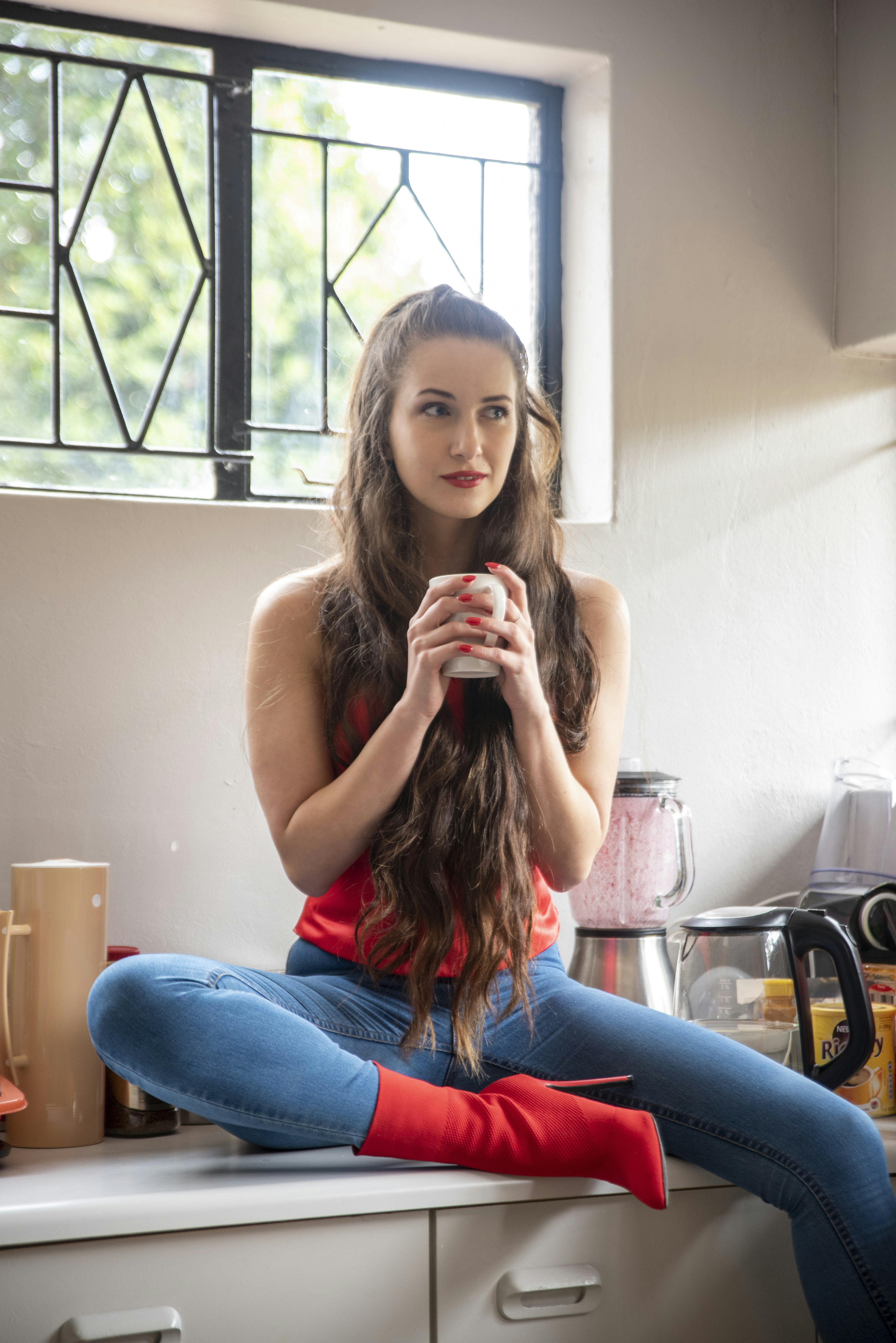 a woman sitting on a counter
