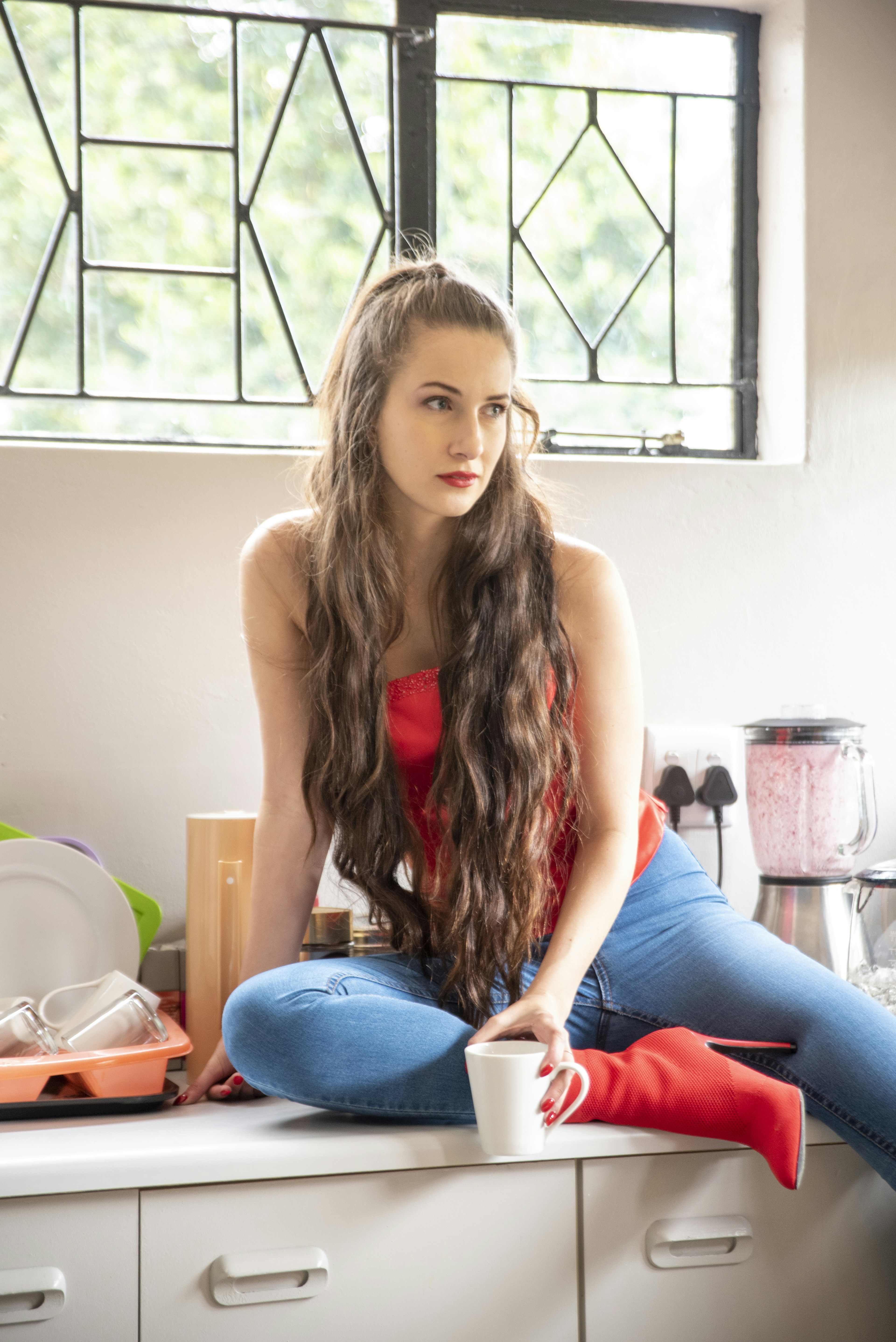 A woman waking up refreshed and happy.