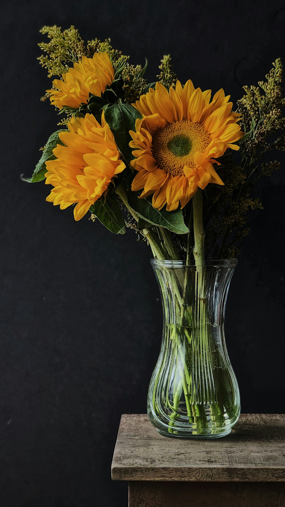 a vase with yellow flowers