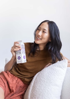 A smiling family enjoying fresh drinking water at home.