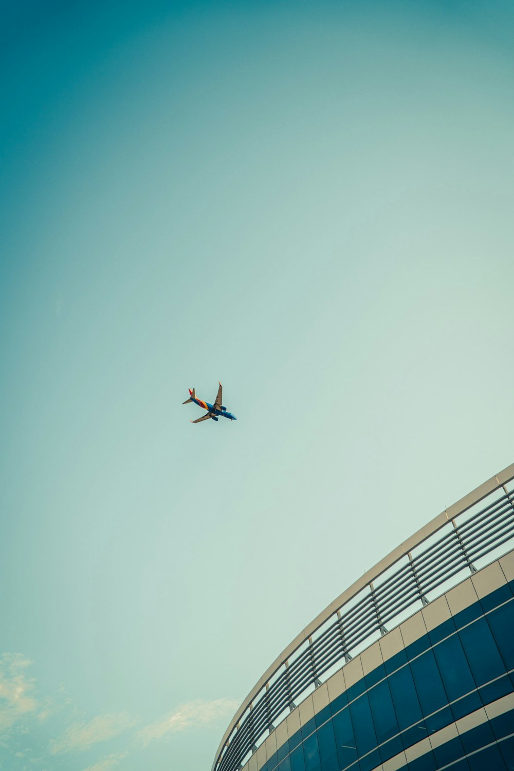 an airplane flying over a building