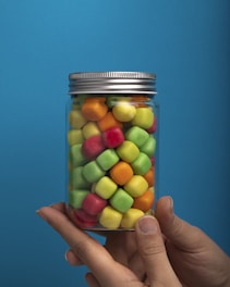 a jar of colorful candies