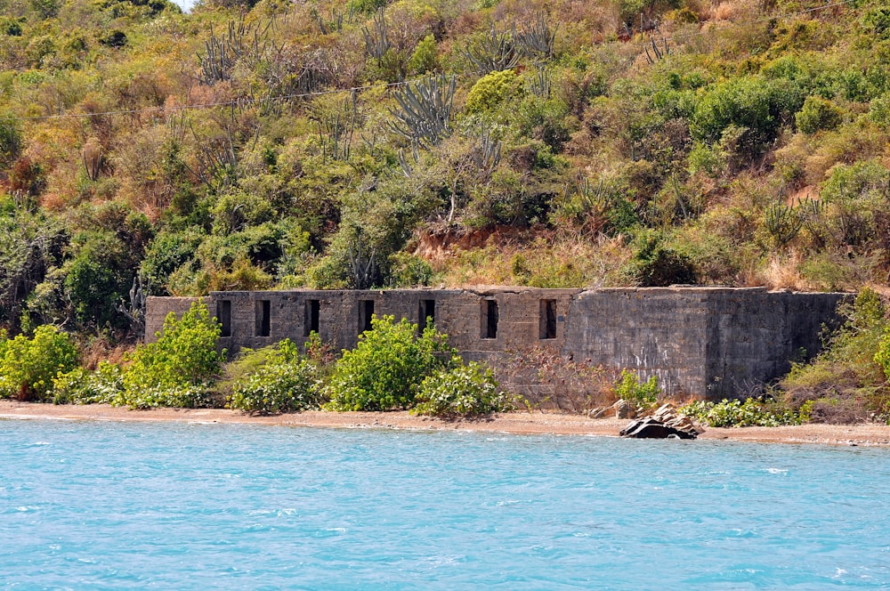 a stone building on a beach