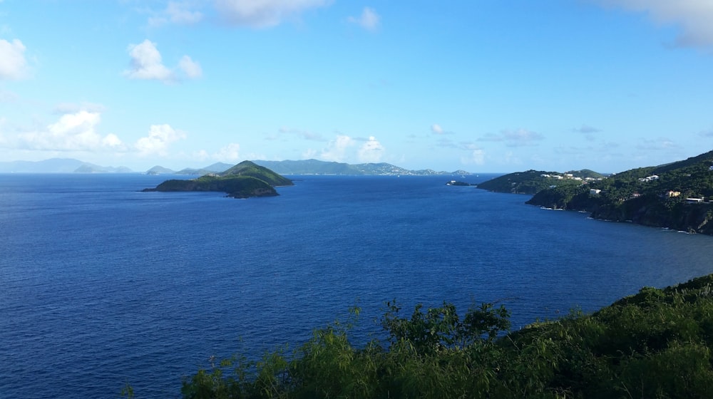 a body of water with land in the back