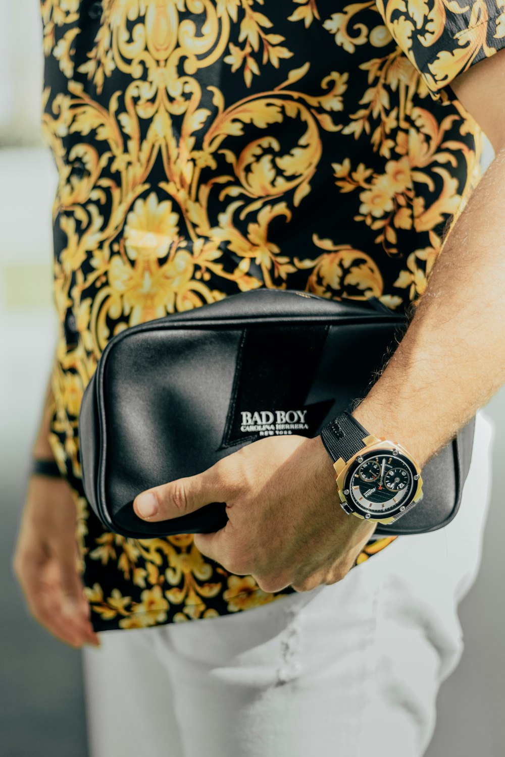 a man holding a black watch