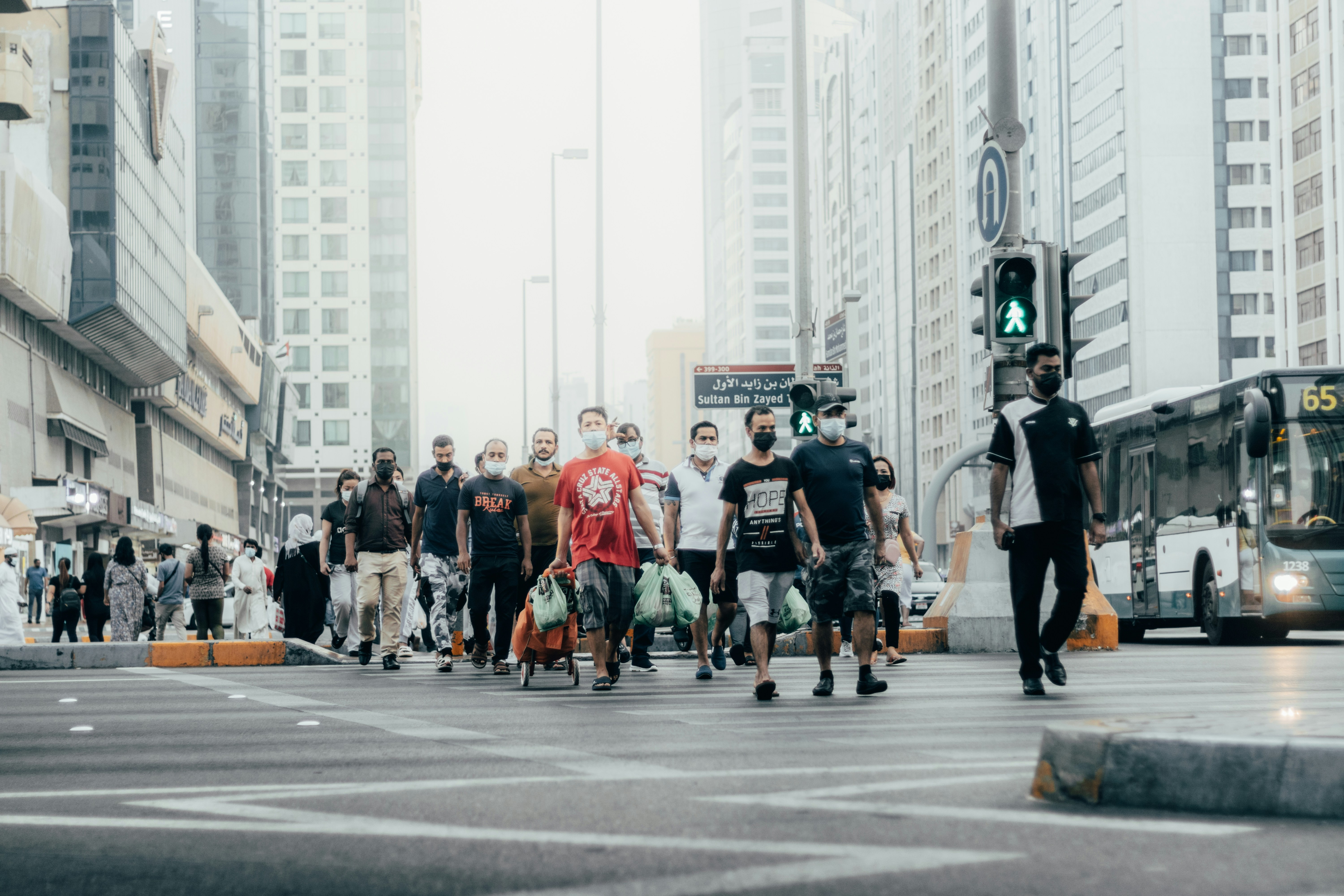 a group of people crossing a street