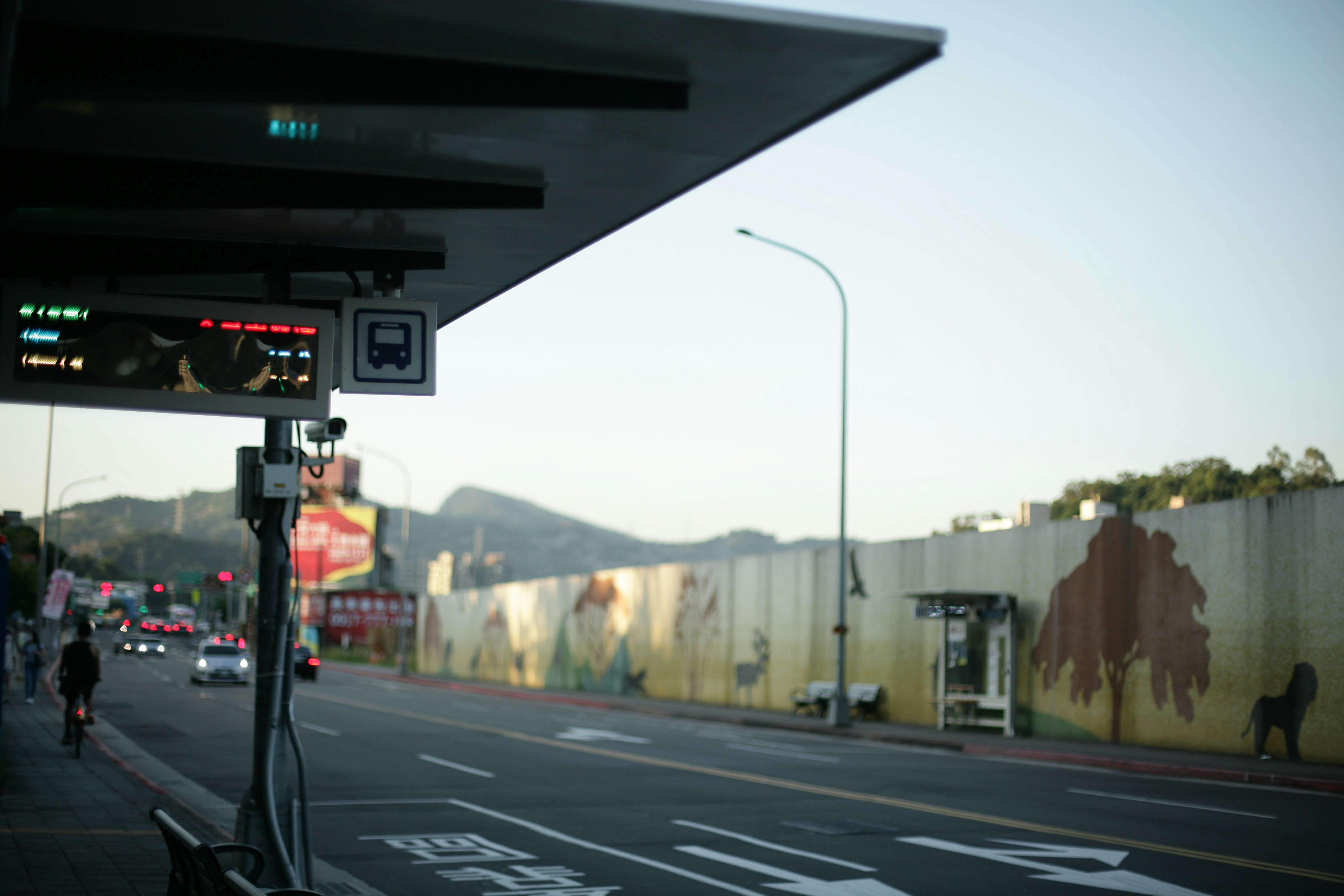 Closeup of an EV fast charging connector plugged in at a snowy station