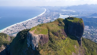 a cliff with a city below