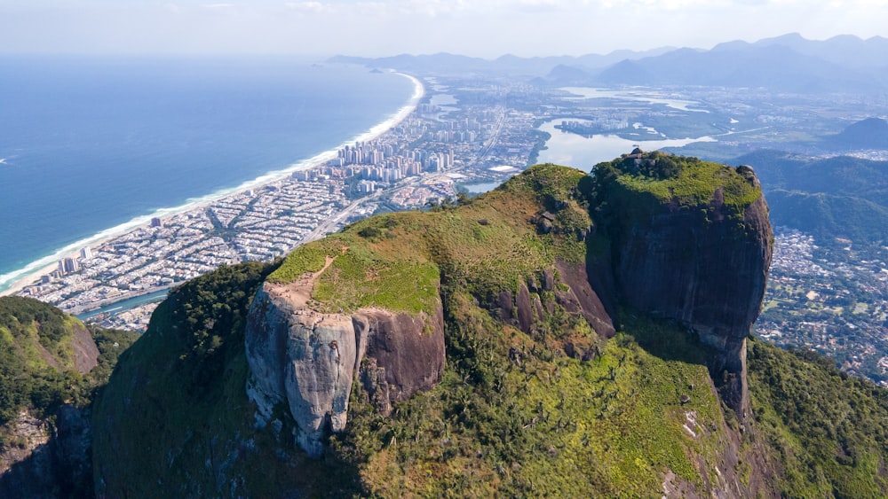 a cliff with a city below