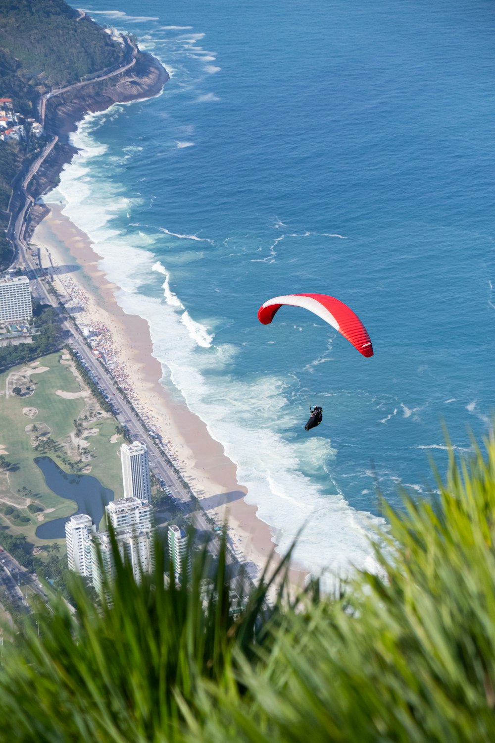 a person parasailing on the beach