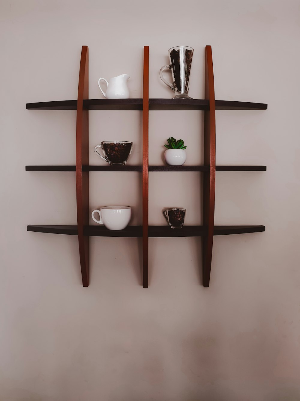 a shelf with cups and tea cups