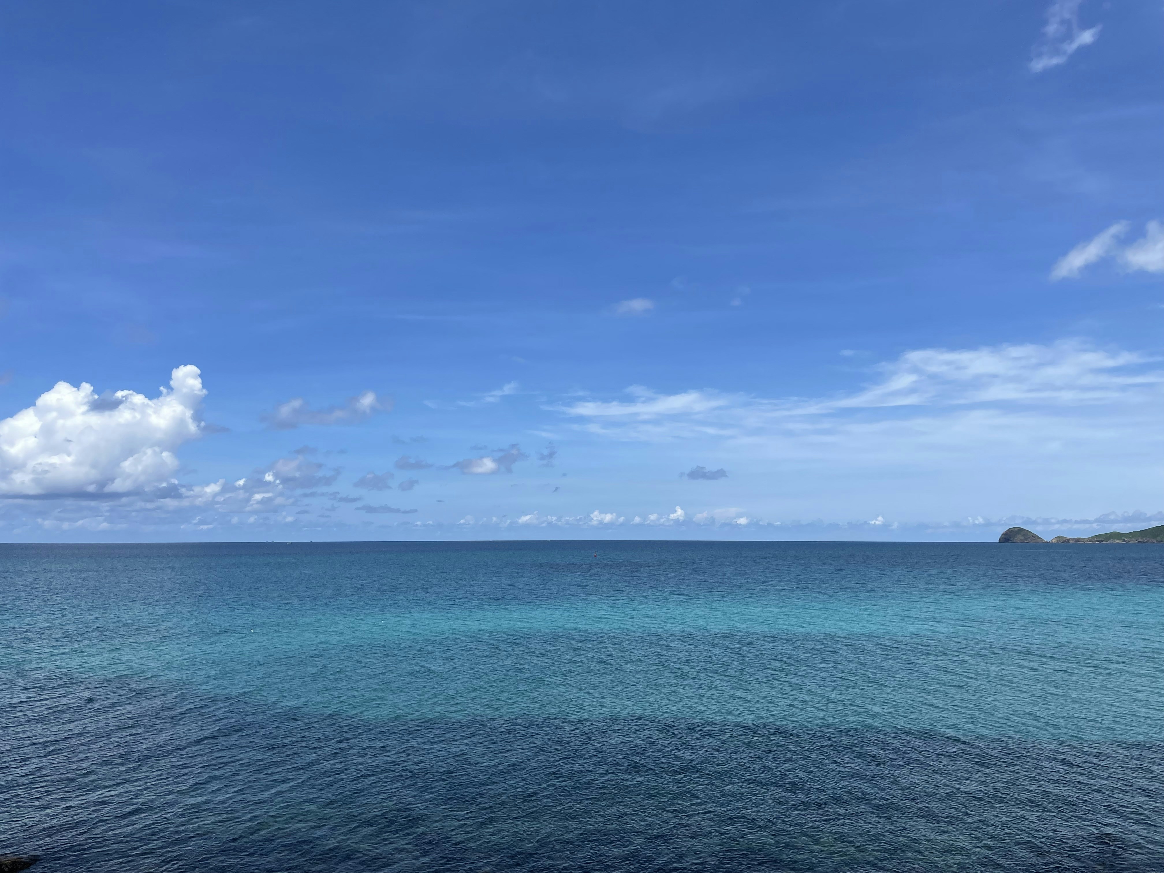 a body of water with land in the distance