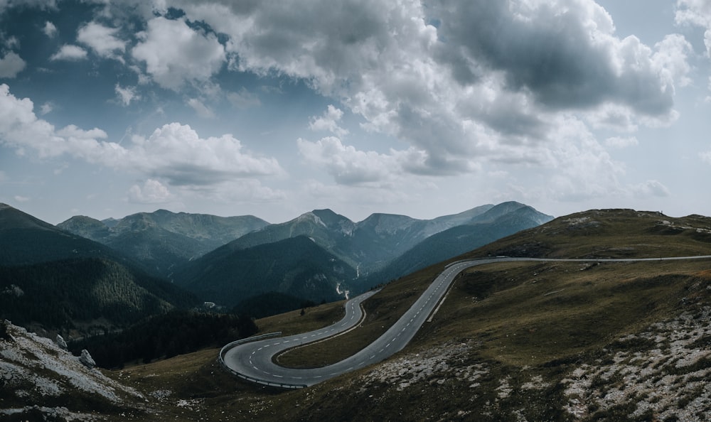 a winding road through a valley