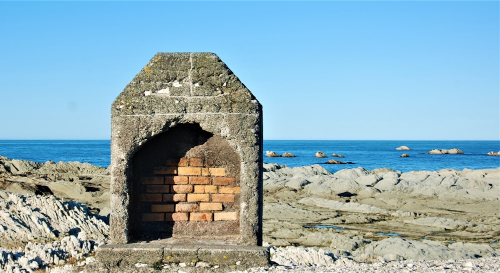 a brick building on a beach