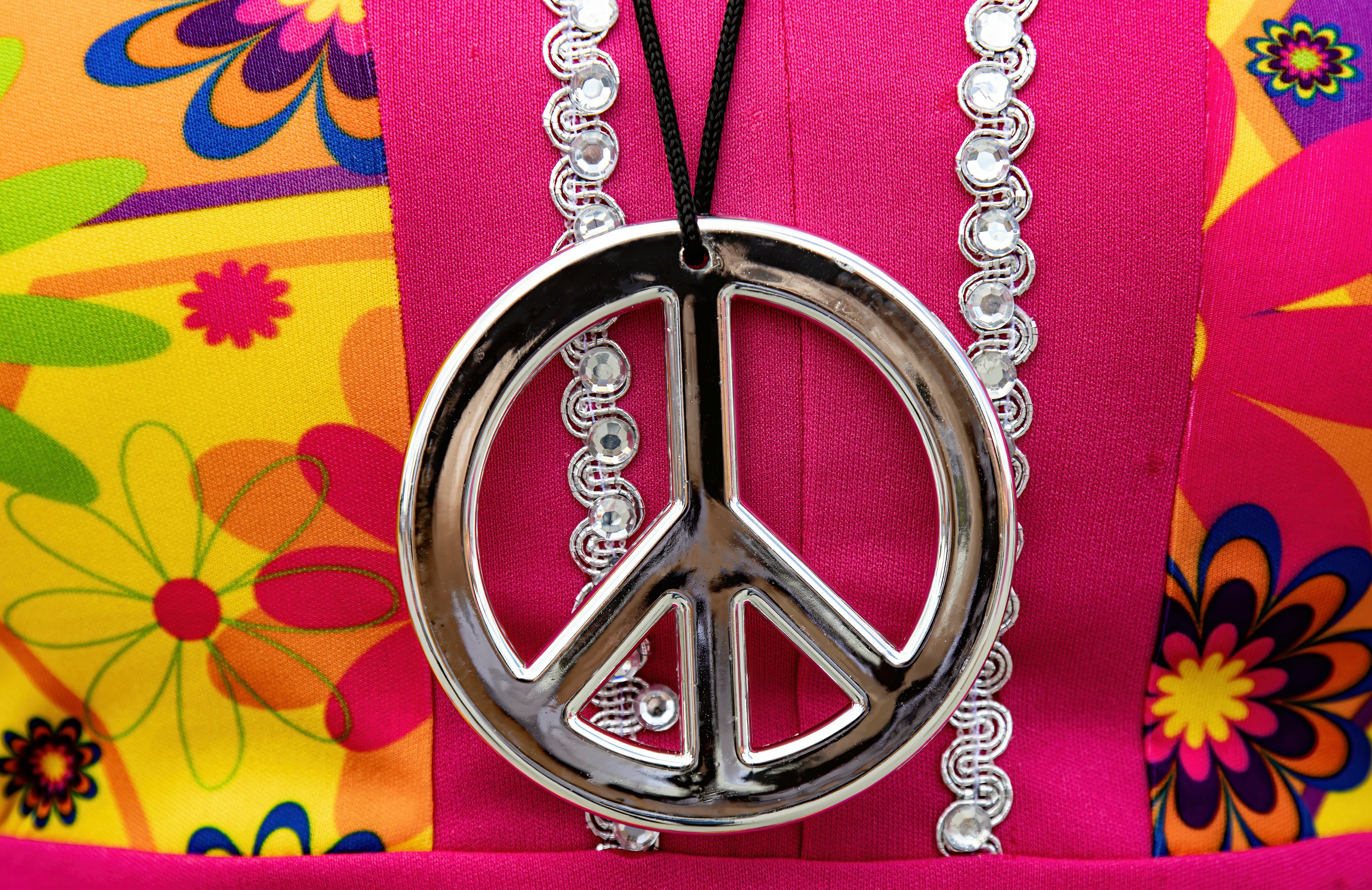 a silver and red medal