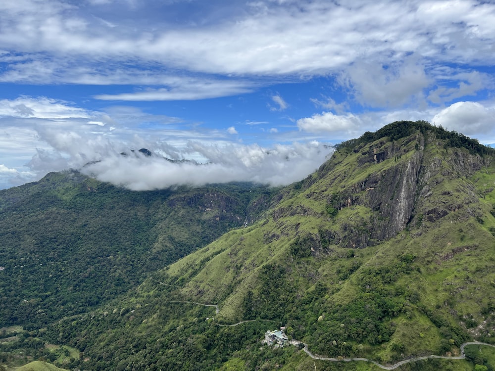 a landscape with hills and clouds