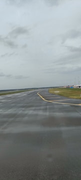 Construction crews working on runway foundations surrounded by water.