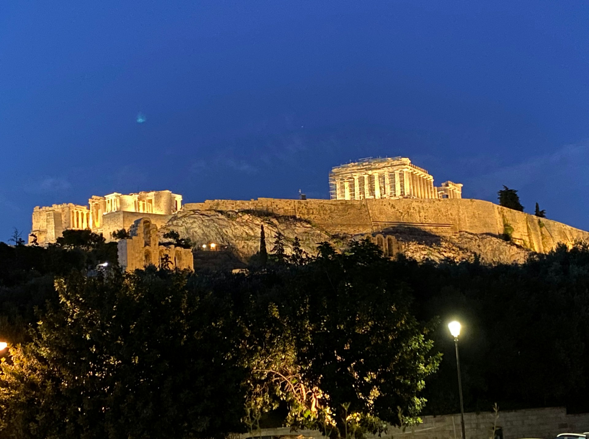 a large stone building on a hill