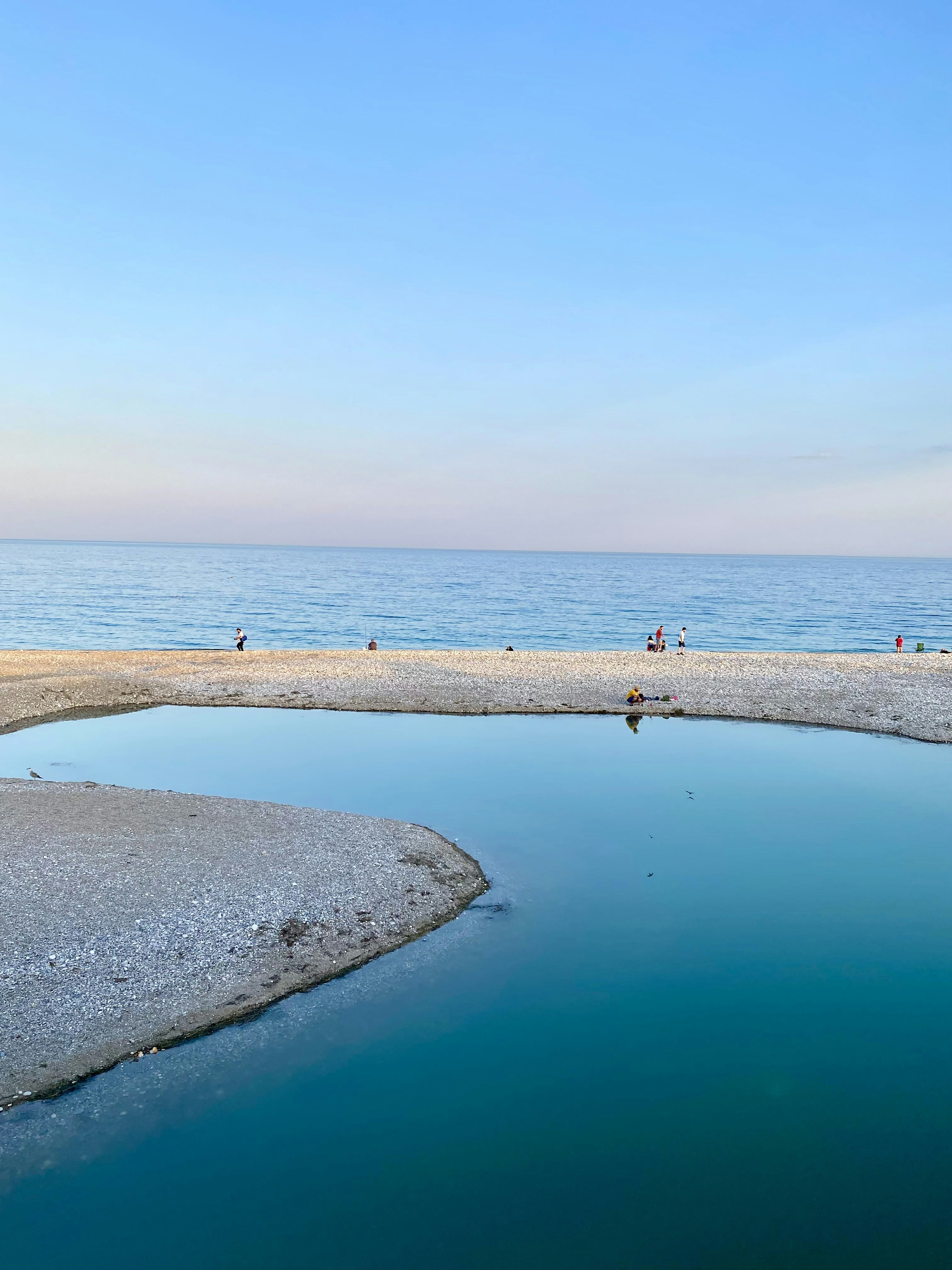 a beach with people on it