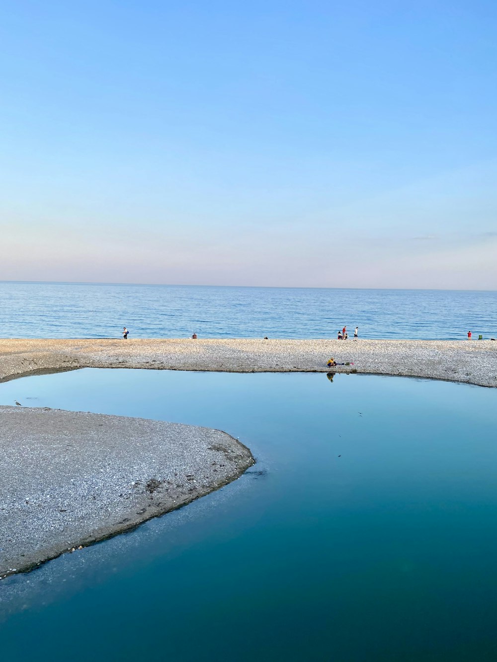 a beach with people on it