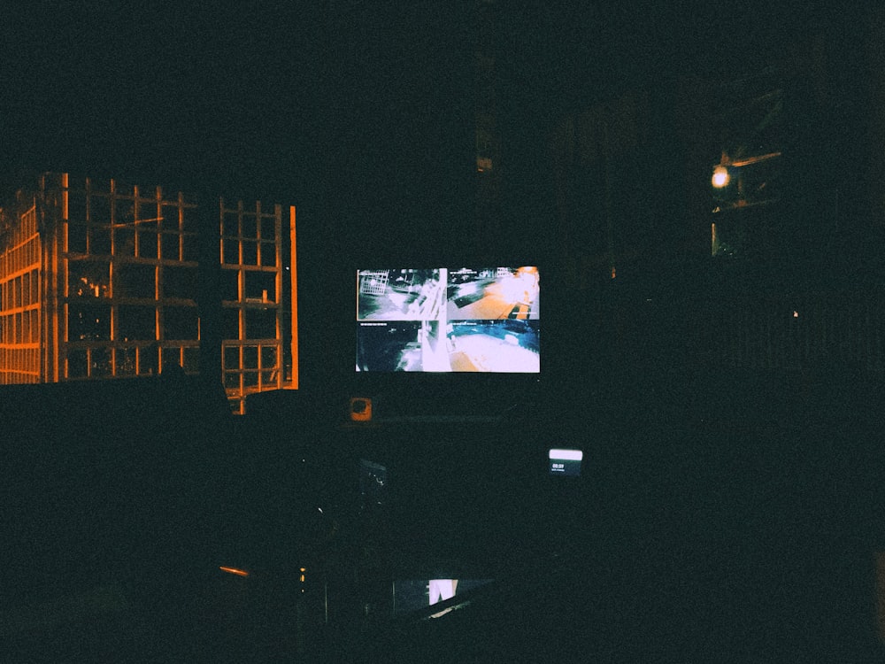 a television screen in a dark room