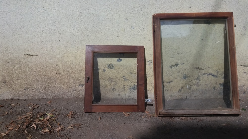 a couple of wooden frames on a wall