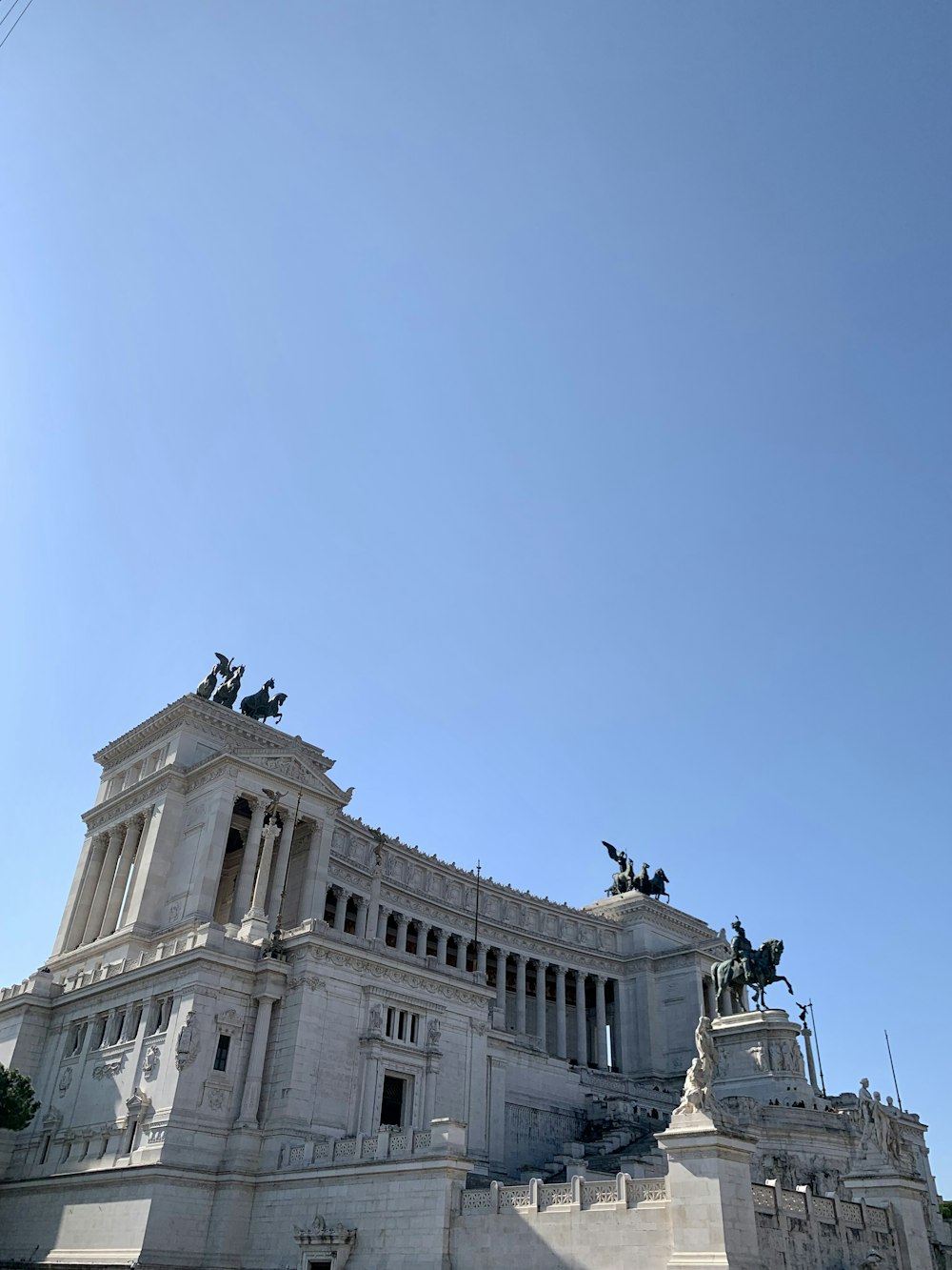 a building with statues on top