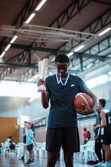 a person holding a basketball