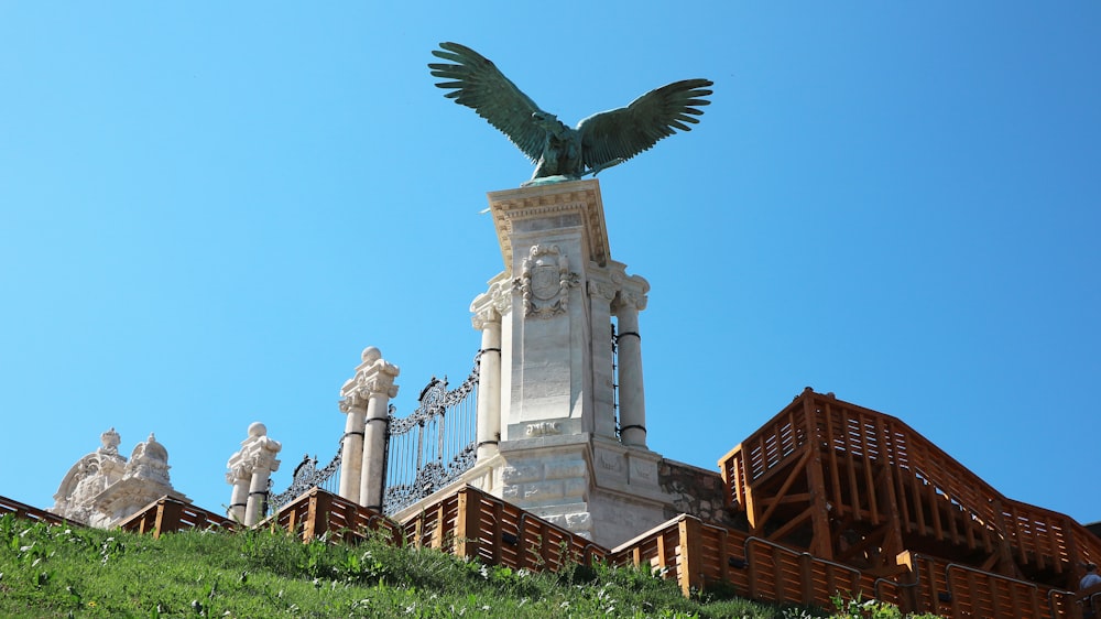 a bird flying over a building