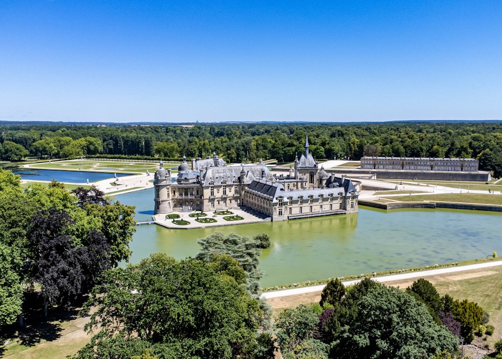 a castle on a hill by a river