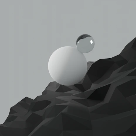 A minimal 3D sculpture showing a smooth sphere balanced atop an inverted pyramid on a cube, set against a warm beige background with soft shadows.