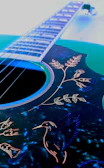 Traditional Purépecha motifs subtly engraved on a custom guitar
