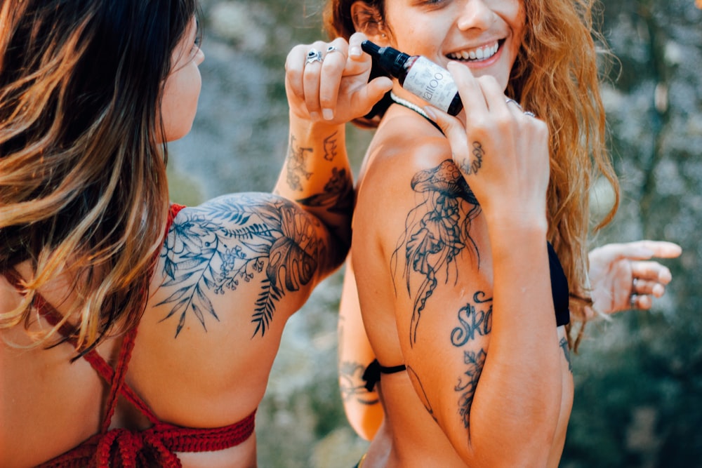 a woman with tattoos on her arm