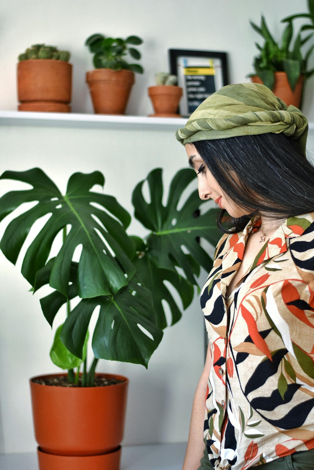 a person looking at a plant