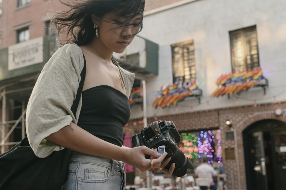 a woman holding a camera