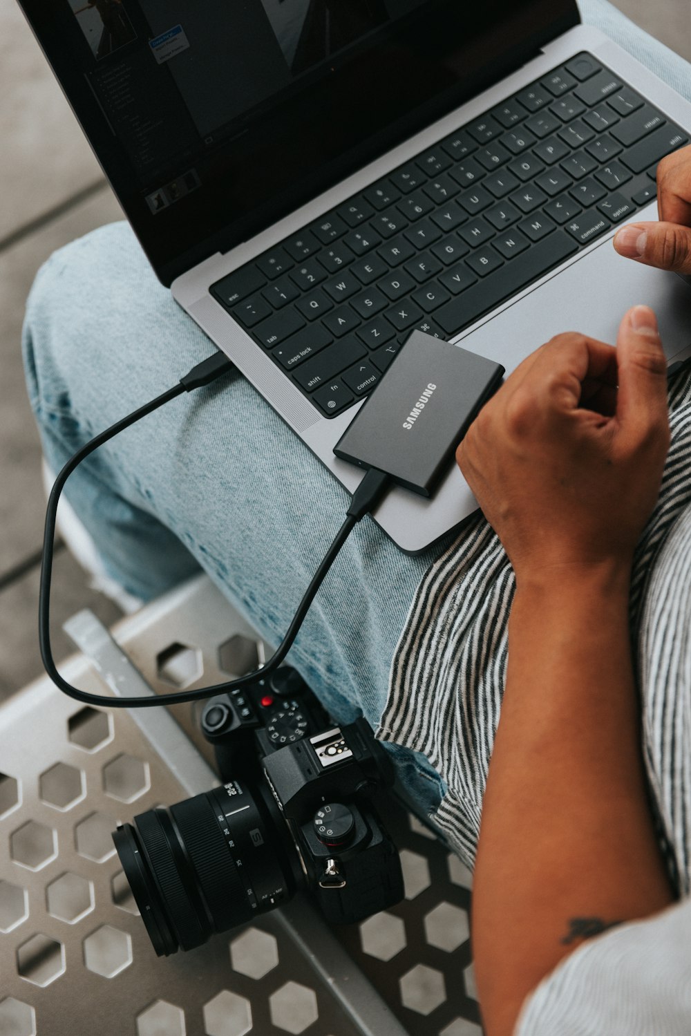 a person holding a laptop