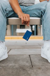 a person holding a blue box