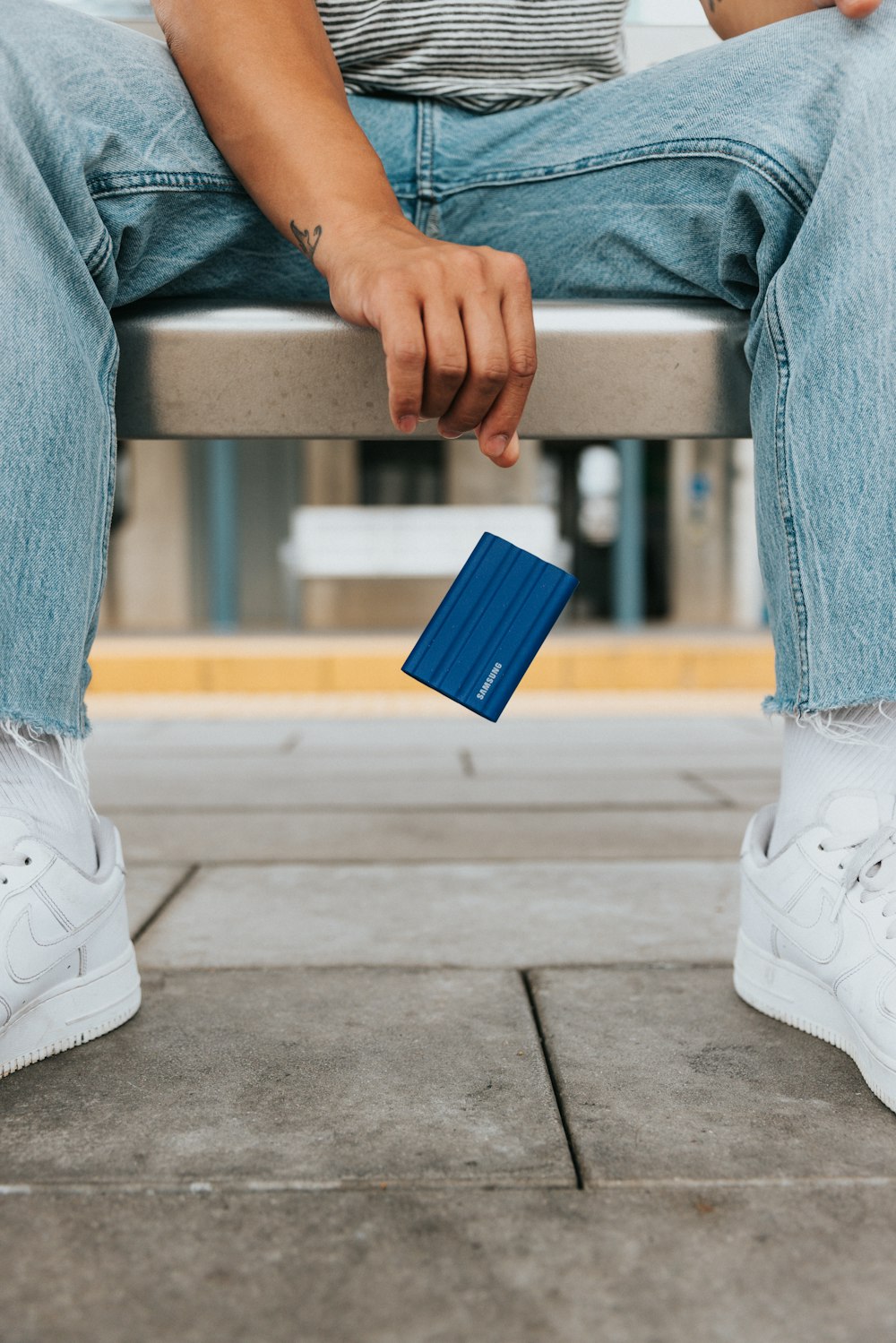 a person holding a blue box