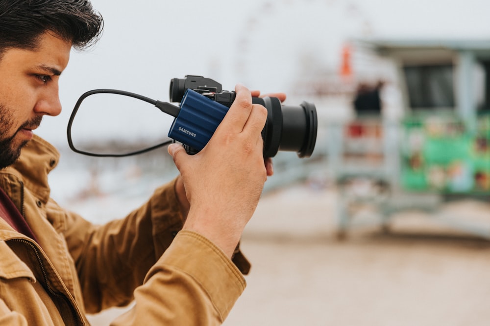 a man holding a camera