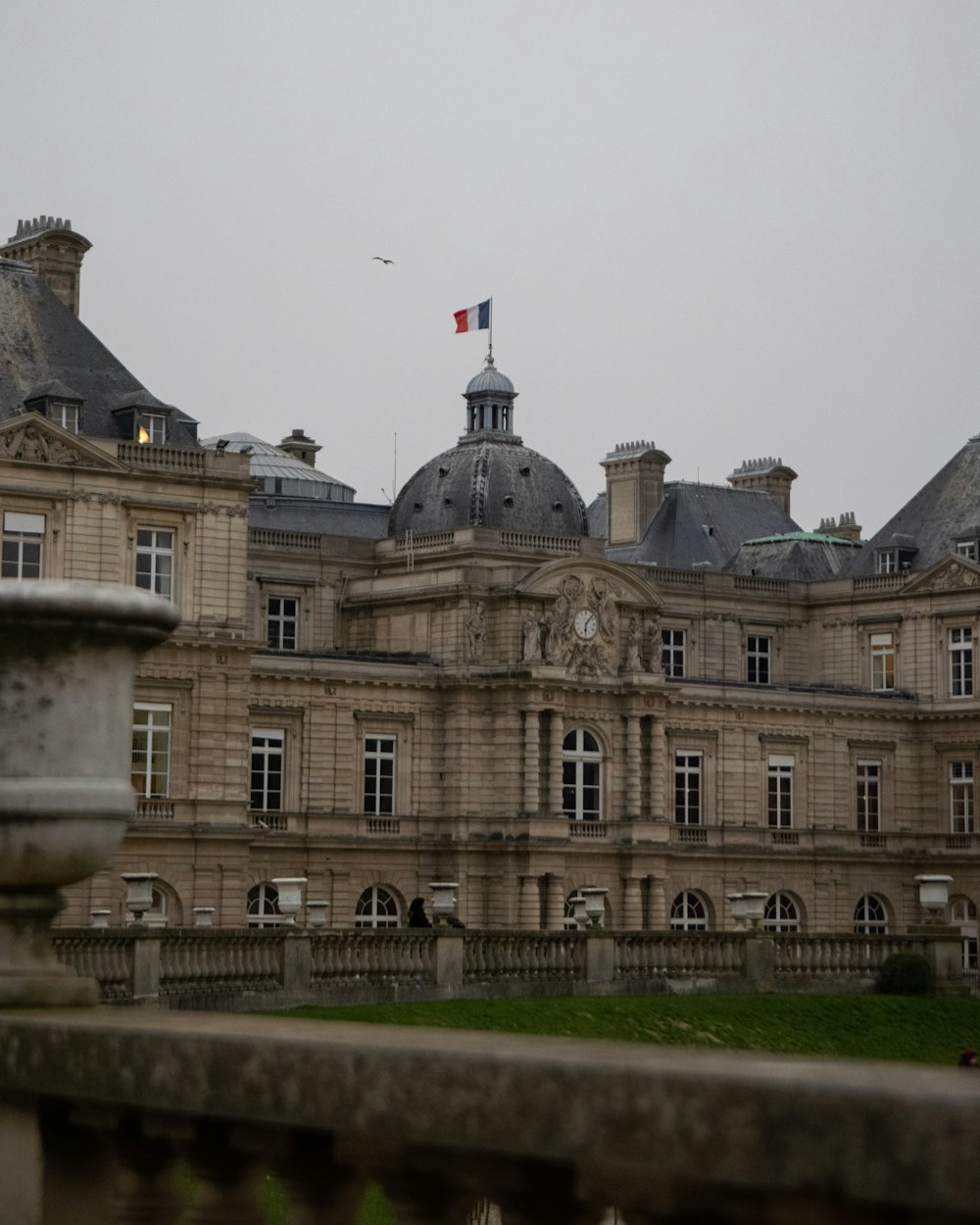 a large building with a flag on top