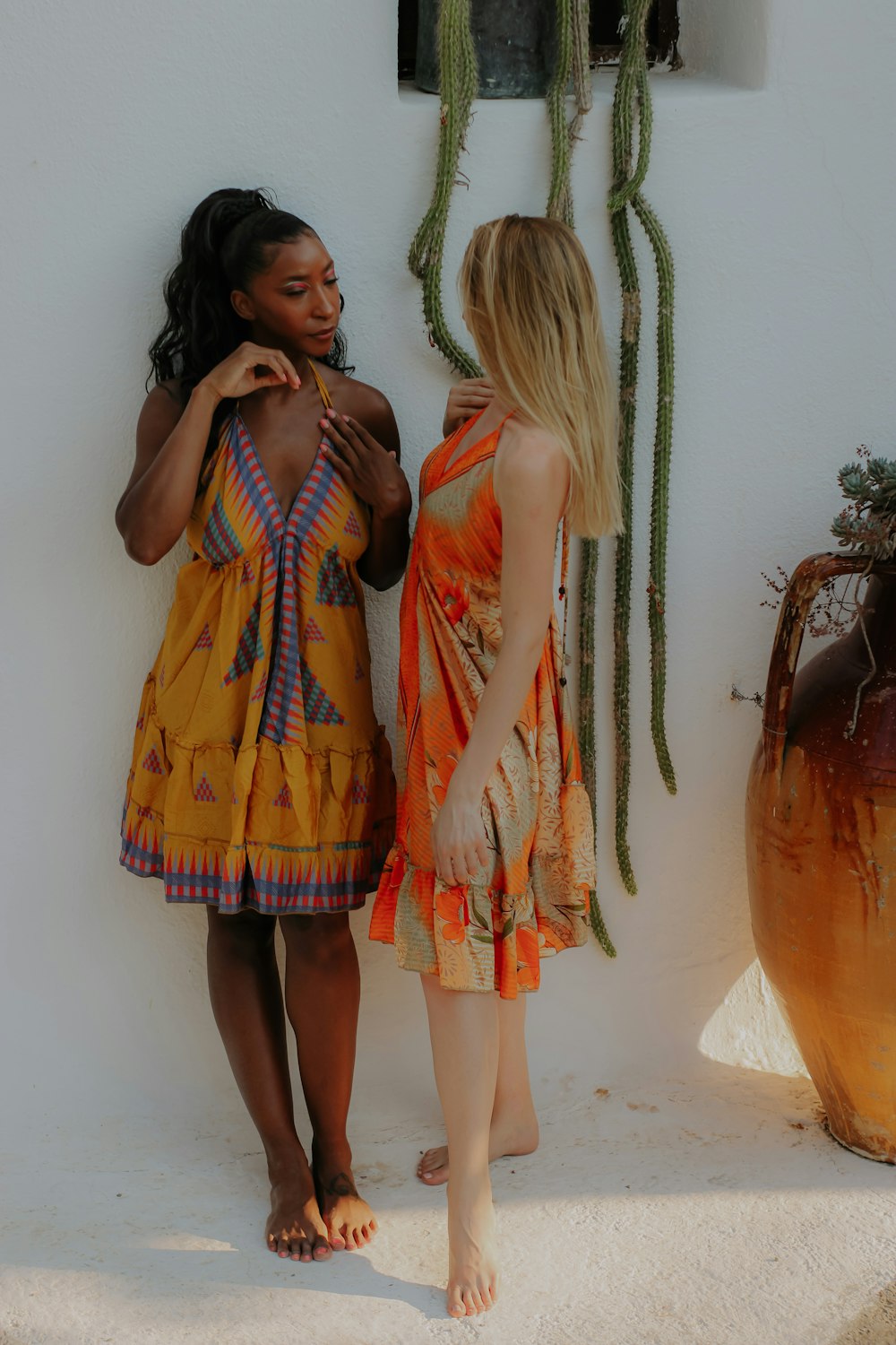 a couple of women in dresses