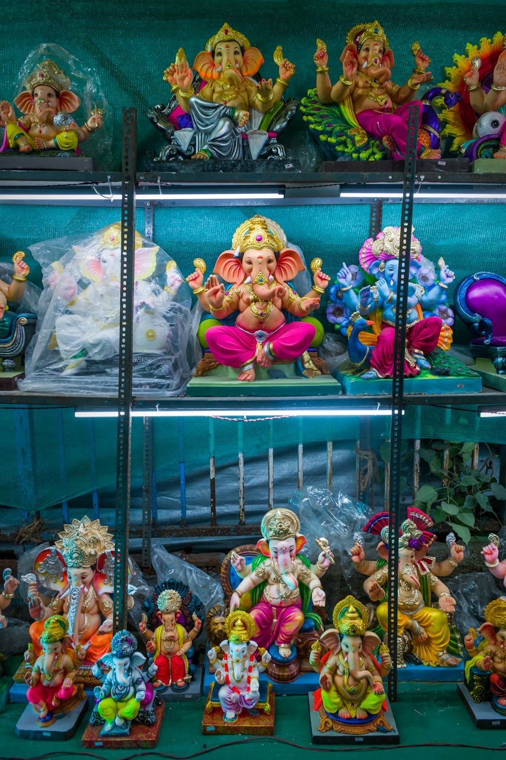 a group of dolls on a shelf