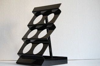 A modern steel shoe rack showcasing sleek design.