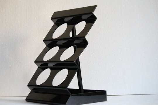 A modern steel shoe rack showcasing sleek design.