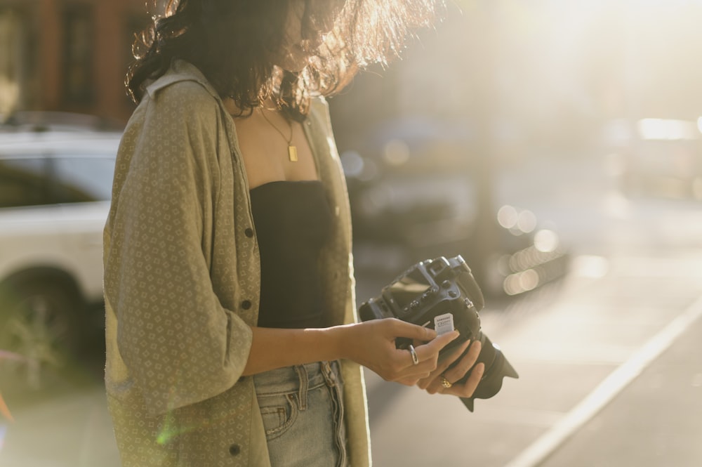 a woman holding a phone