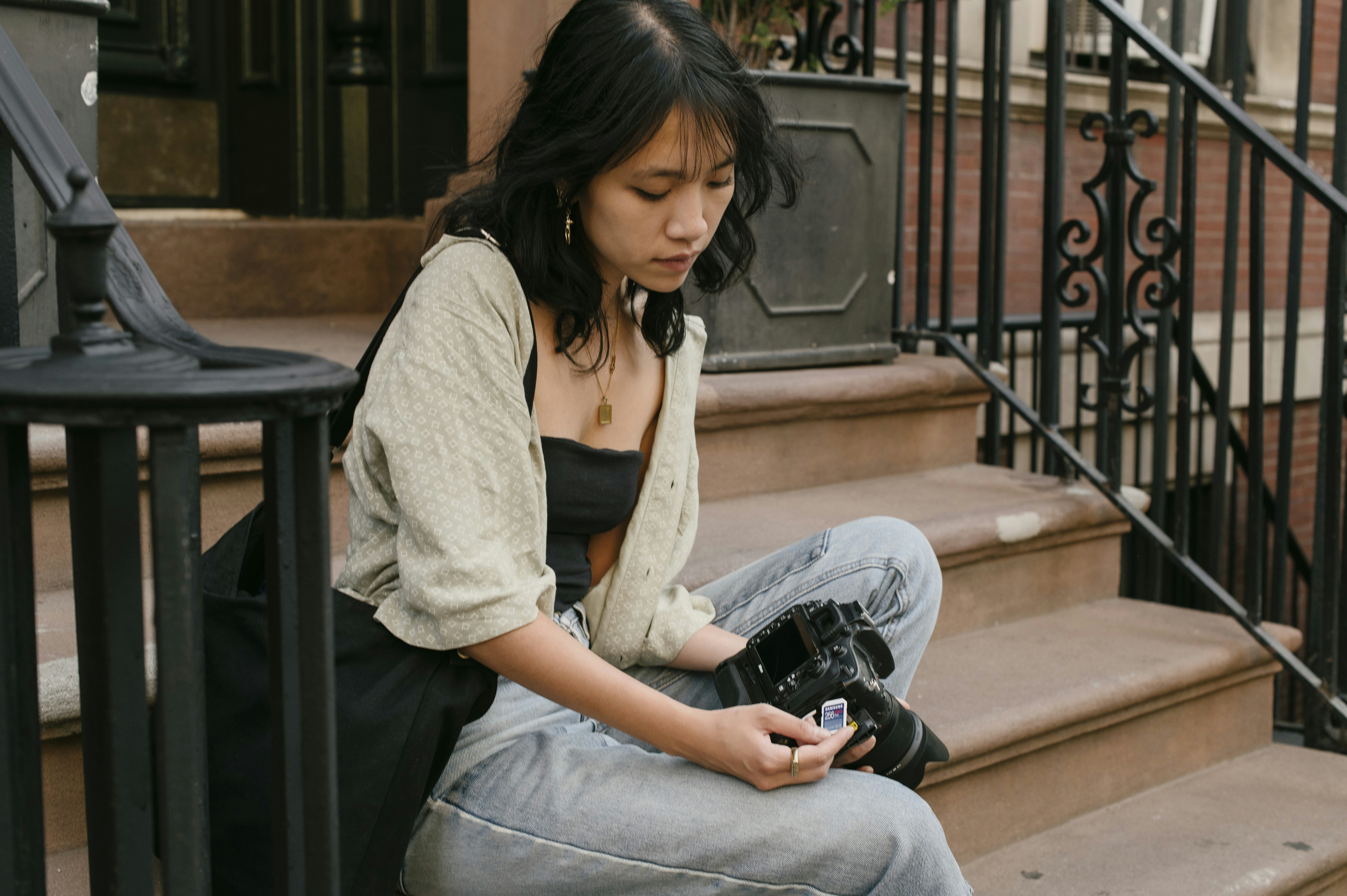 a woman sitting on a staircase
