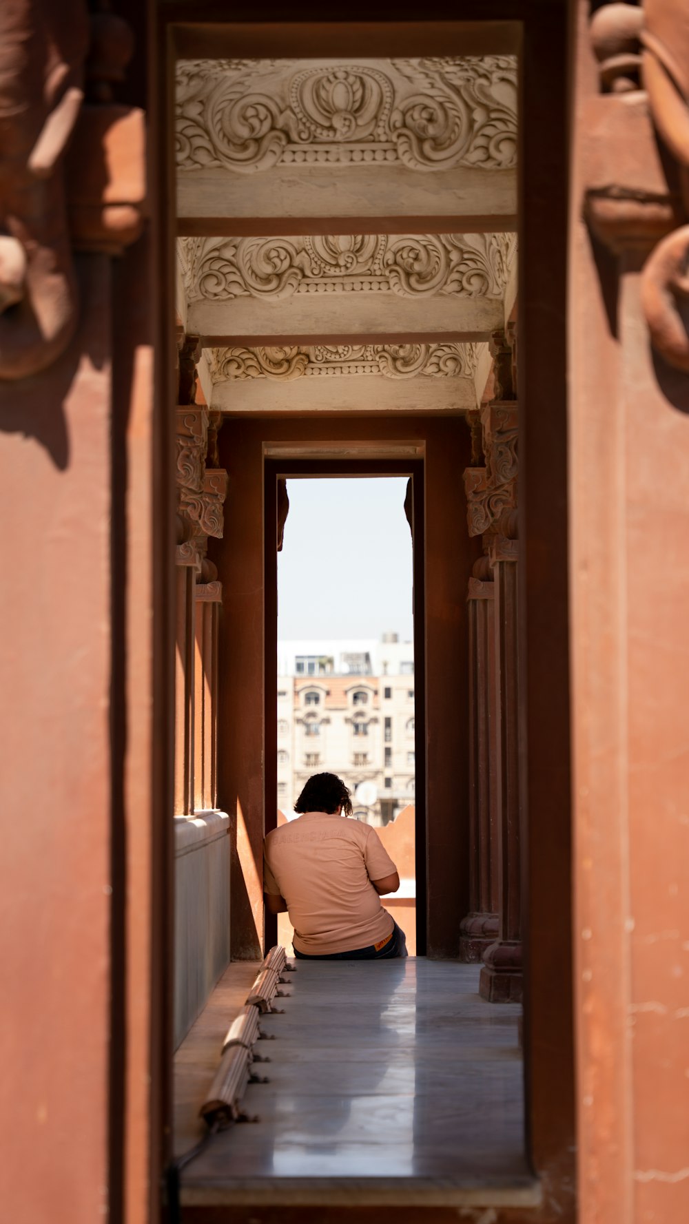 a person sitting in a doorway